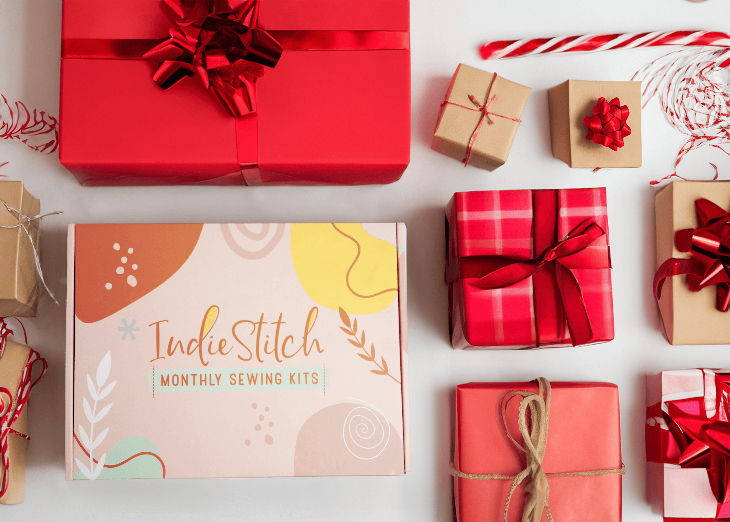 IndieStitch box surrounded by wrapped gifts